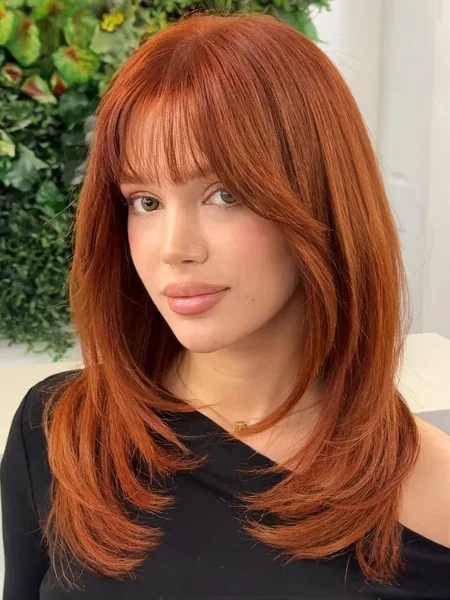Vibrant Copper Silk Layers with Soft Brow-Skimming Bangs