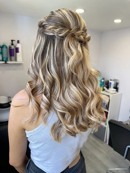 Voluminous Half-Up Waves with Twisted Crown Detail