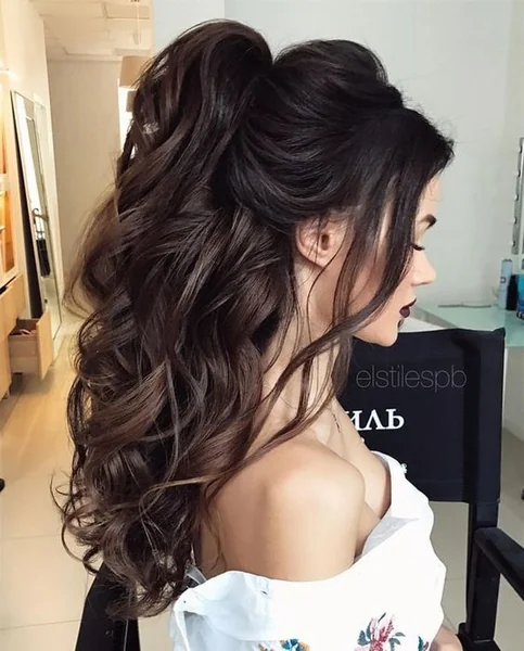 Voluminous Brunette High Pony with Face-Framing Tendrils