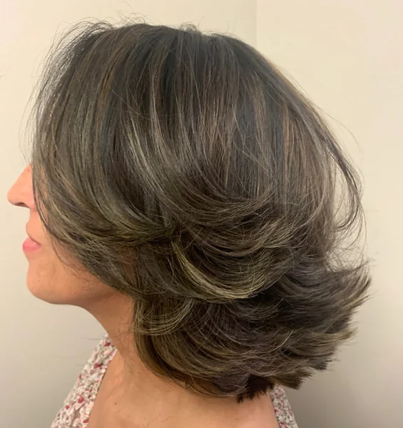 Voluminous Brunette Shag with Feathered Sweeping Bangs