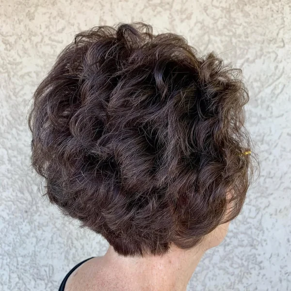 Voluminous Brunette Stacked Bob with Tousled Curls