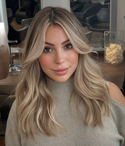 Voluminous Honey Blonde Curtain Bangs for Winter