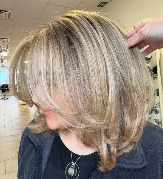 Voluminous Honey Blonde Midi with Seamless Face-Framing Layers
