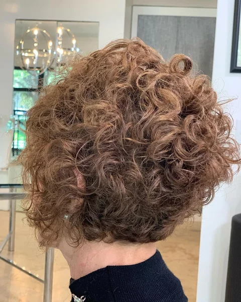Voluminous Honey Brown Pixie with Stacked Curls