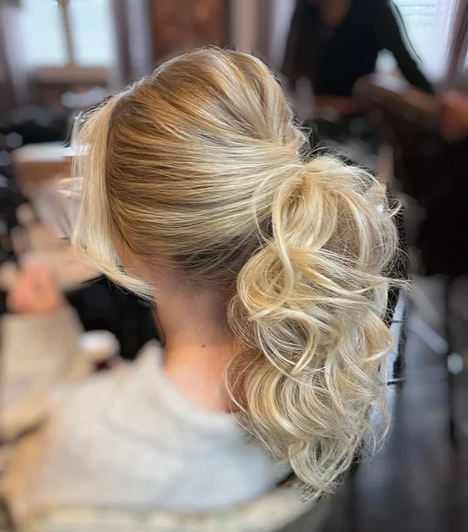 Voluminous Messy High Ponytail with Natural Curls