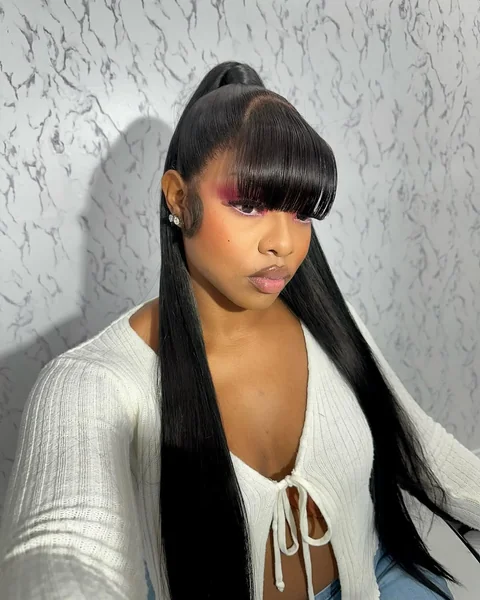 Voluminous Retro Ponytail with Side-Swept Curls