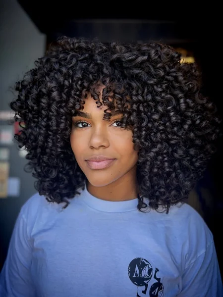 Voluminous Ringlet Afro with Soft Curly Bangs