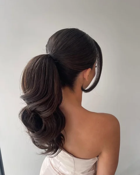 Voluminous Wavy Blonde Casual Low Ponytail