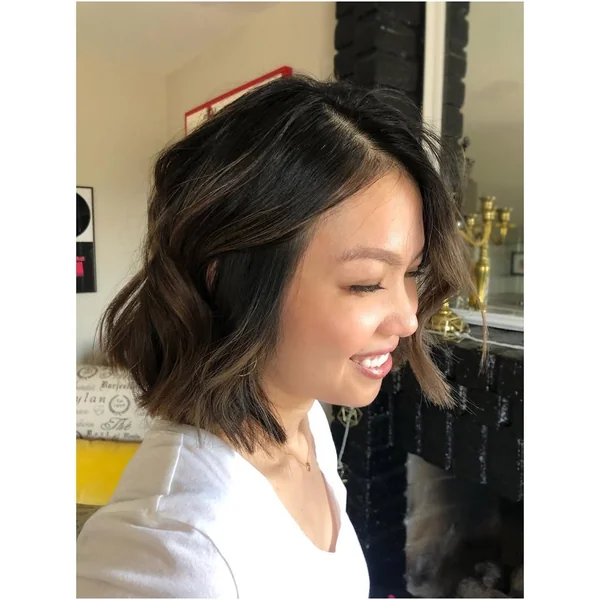 Wavy Brunette Bob with Subtle Sun-Kissed Balayage
